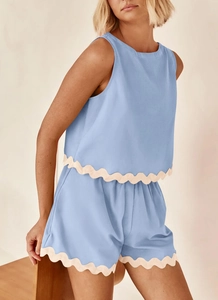 Detail of blue sleeveless top and shorts set with scalloped lace trim in cotton linen