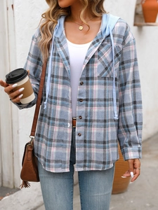 Detail view of the blue plaid oversized shirt with button pocket and high-quality cotton texture