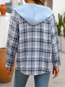 Back view of a casual plaid hooded shirt with curved hem and pleat detail on a terrace