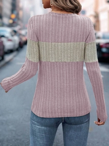 Close-up of the textured ribbed knit fabric and two-tone color block design on the shirt