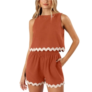 Women's two-piece linen set with sleeveless top and shorts featuring scallop lace trim