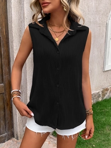 Close-up of black sleeveless button-up polo shirt with textured fabric and wavy patterns
