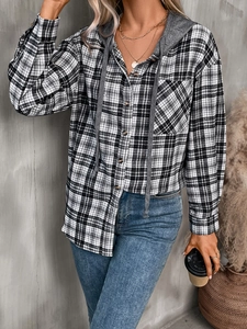 Detail of oversized plaid shirt for women featuring a grey knit hood and button pockets