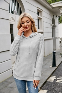 Detail of light grey ribbed knit hoodie with drawstring hood and kangaroo pocket