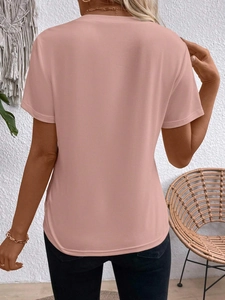 Back view of a dusty pink crew neck short sleeve T-shirt with a curved hem design