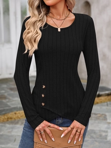 Detail of ribbed knit top featuring asymmetric overlapping hem and side button accents