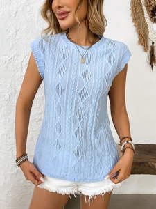 Detailed view of light blue cable knit texture and diamond eyelet pattern on the summer top