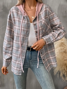 Detail of a plaid button-up shirt with a pink drawstring hood and soft brushed texture