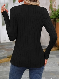 Detailed back view of a black slim fit long sleeve ribbed knit top with a crew neck