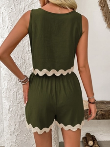 Rear view of olive green two-piece linen set with white scalloped lace trim details
