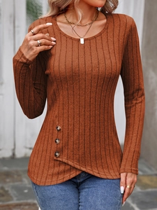 Detail of ribbed knit fabric on brown long sleeve top with asymmetric button hem