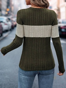 Detail of olive and cream colorblock ribbed knit top showing back texture and fit
