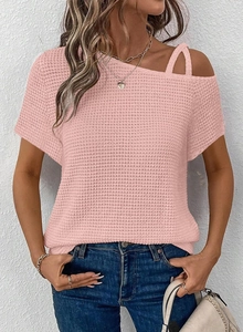 Close-up of pink waffle knit texture and asymmetric off-shoulder strap detail for women