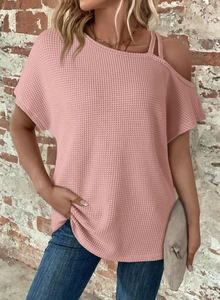 Detail of pink waffle knit texture and cold shoulder design on women short sleeve top