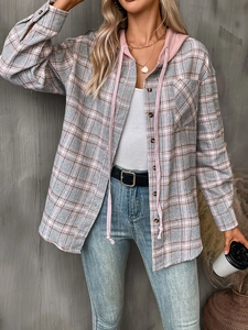 Detailed view of women's oversized plaid shirt with pink hood and wooden button texture