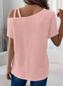 Rear view of pink waffle knit off-shoulder top showing detailed fabric texture and fit