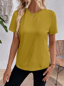 Detail of ginger yellow round neck T-shirt featuring decorative diagonal quilting texture
