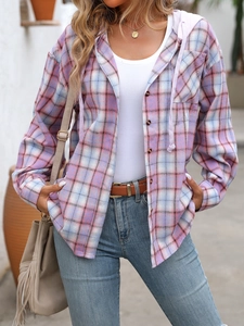 Detailed close-up showing the soft plaid fabric texture and hood of the oversize shirt