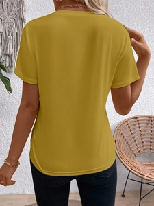 Back view of mustard yellow short sleeve T-shirt with a curved hem on a model