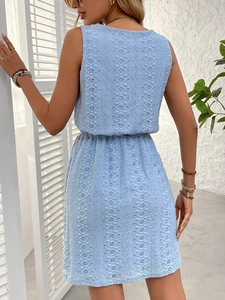 Detail view of the light blue sleeveless dress with eyelet embroidery and elastic waist
