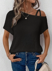 Detail of black waffle knit texture on this asymmetric cold shoulder short sleeve top