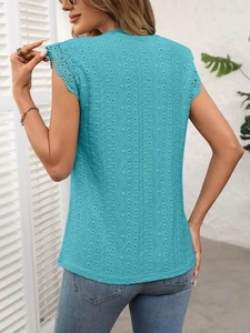 Detailed view of lake blue sleeveless top featuring intricate lace embroidery and hollow-out mesh