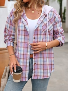 Detailed close-up of a pink plaid hooded shirt with front pocket and adjustable drawstrings