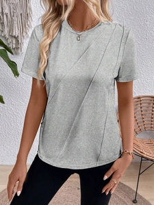 Detail of grey heather t-shirt featuring unique diagonal pleat stitching and soft texture