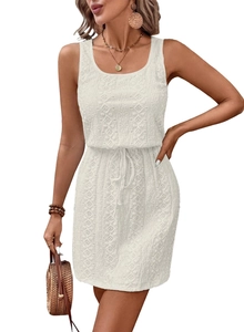 Detail of white sleeveless lace dress featuring intricate floral crochet and drawstring waist
