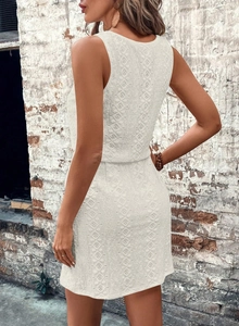 Close-up of white lace texture and floral hollow design on a square neck sleeveless dress