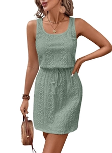 Detailed close-up of sage green sleeveless lace dress with drawstring waist and floral patterns