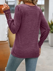 Rear view of wine red knit shirt with decorative sleeve buttons and puff shoulder detail