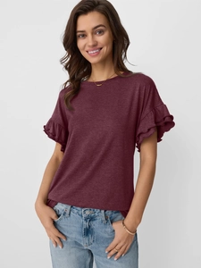 Detail view of burgundy ruffle sleeve t-shirt paired with light wash denim jeans