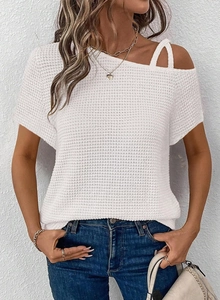 Detail of white hollow knit top featuring asymmetric cold shoulder and waffle texture