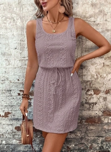 Detailed view of lavender sleeveless lace dress with intricate floral hollow-out texture