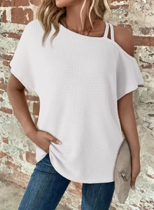 Detail of white waffle knit texture and cold shoulder strap design on stylish women top