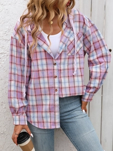 Detail of pink plaid hooded shirt featuring chest pocket and soft brushed fabric texture