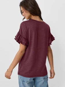 Detailed back view of burgundy t-shirt featuring elegant layered ruffle sleeves texture