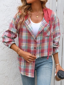 Close-up of oversize plaid shirt with red drawstring hood and tortoise buttons details