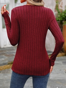 Detailed back view of a burgundy ribbed knit long sleeve top with slim fit tailoring