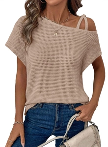 Close-up of beige waffle knit short sleeve top featuring unique cold shoulder strap detail