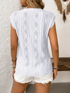 Detailed back view of a white jacquard tank top featuring geometric hollow patterns
