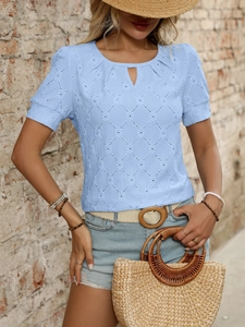 Close-up of light blue hollow-out knit t-shirt with diamond pattern and V-neck detail