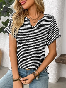 Detail shot of the V-neckline and fine knit striped texture on a summer t-shirt
