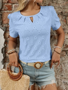 Close-up of light blue eyelet knit fabric with keyhole neckline and puff sleeves details