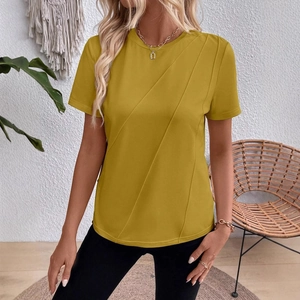 Mustard yellow short sleeve T-shirt with diagonal pleats and relaxed round neck