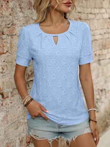 Close-up of light blue short sleeve top featuring hollow diamond pattern fabric