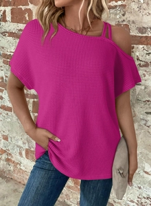 Close-up of rose red waffle knit texture on this off-shoulder women's top