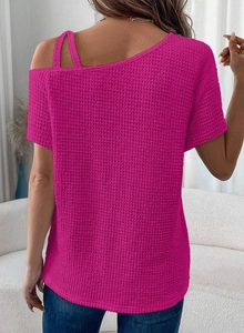 Close-up of pink waffle knit texture and cold shoulder strap detail on short sleeve top