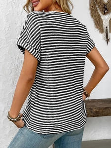 Detail of classic black and white striped short sleeve T-shirt with rolled cuff design